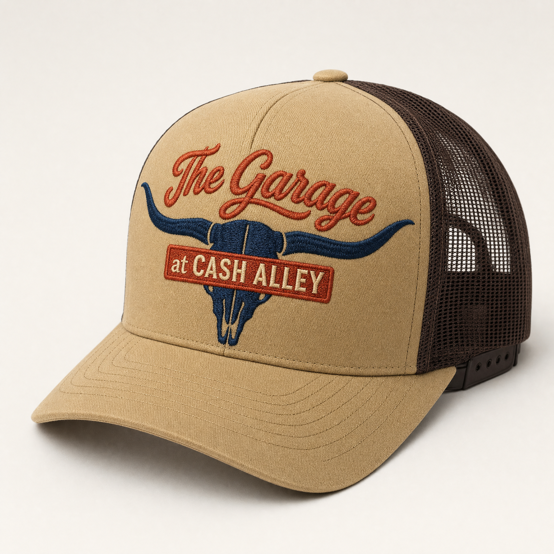 Longhorn trucker hat in tan and brown with navy skull embroidery