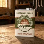 Rosemary Garlic Tallow Cooking Oil 16 fl oz cream steel tin on a garage concrete floor